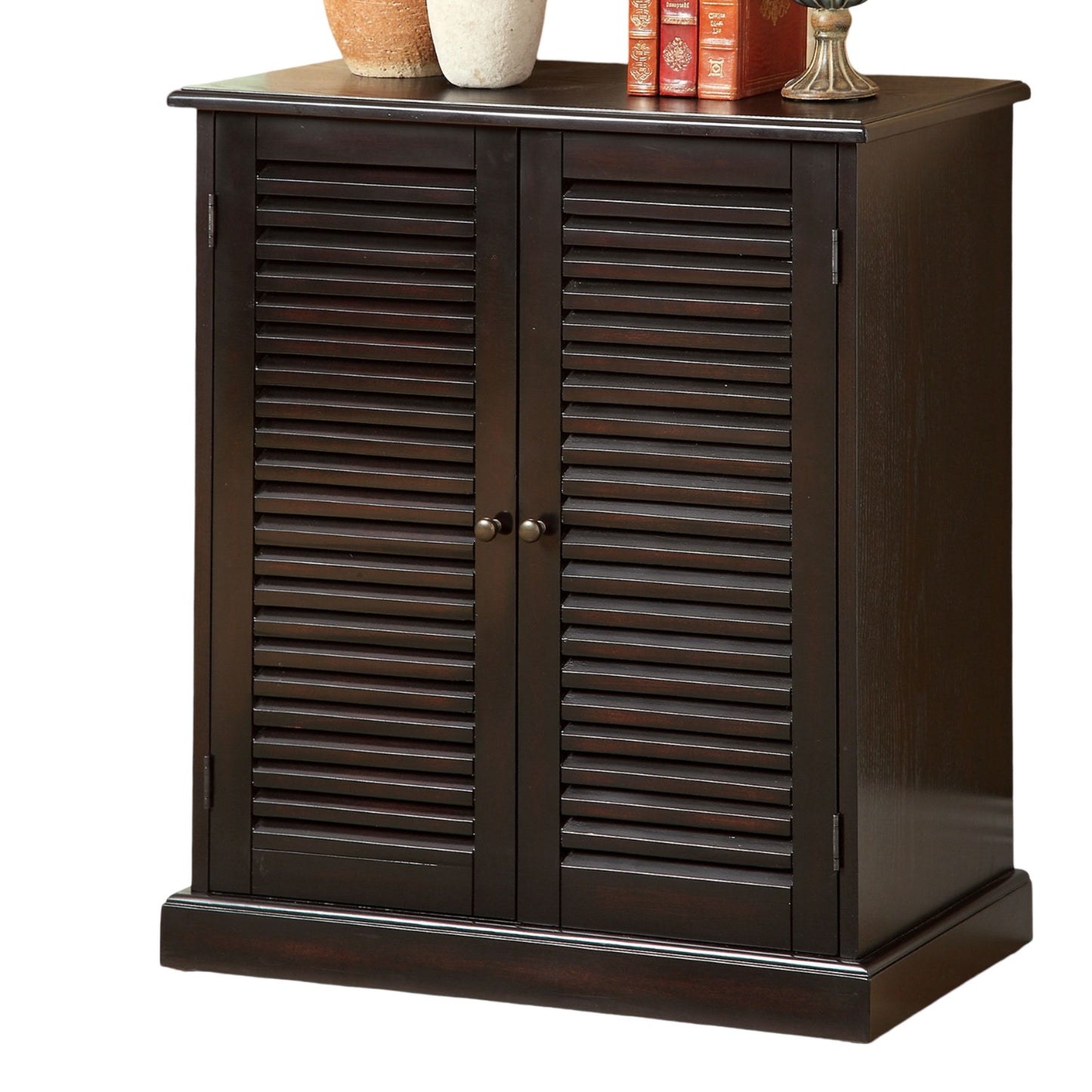 Dark brown louvered door cabinet with two small round knobs
