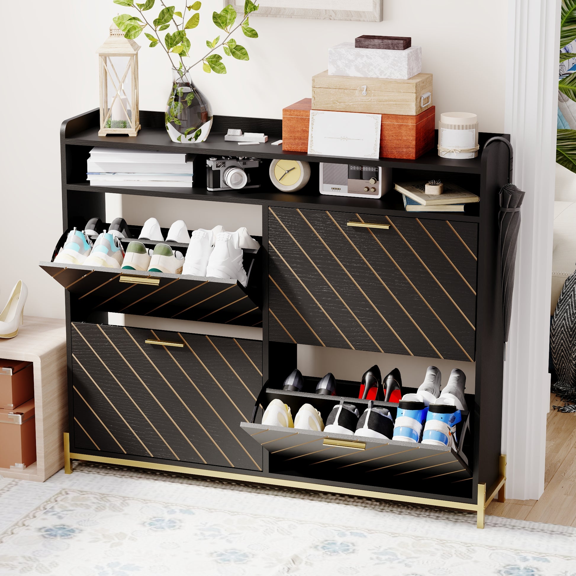 Black wood shoe cabinet with gold trim and slanted line details
