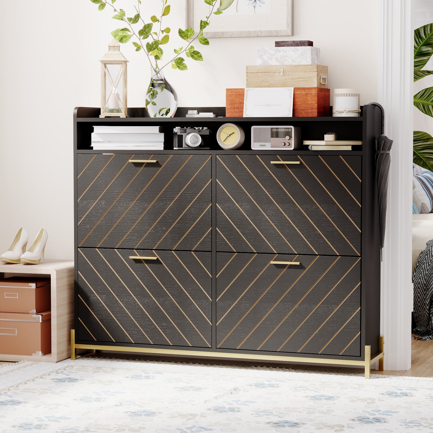 Dark gray shoe cabinet with gold diagonal accents and brass legs