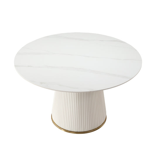 Round white marble dining table with ribbed pedestal base and brass trim