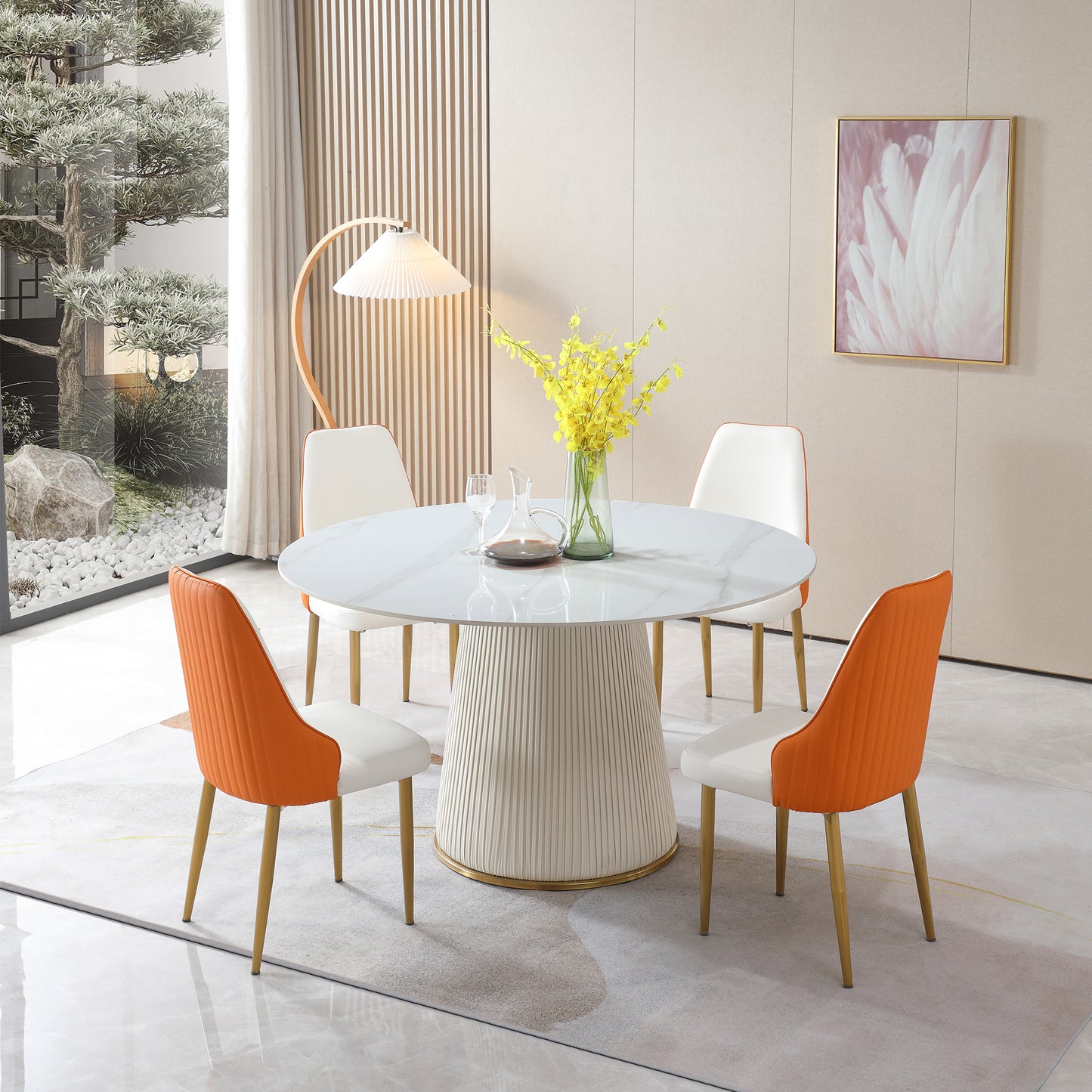 Round marble top dining table with fluted pedestal base and four chairs