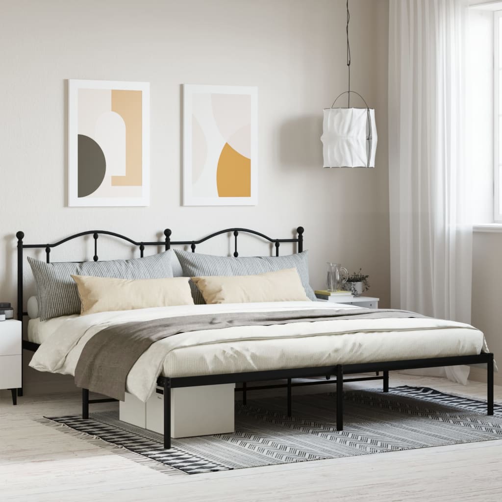 Ornate black metal queen bed frame with classic scrollwork headboard