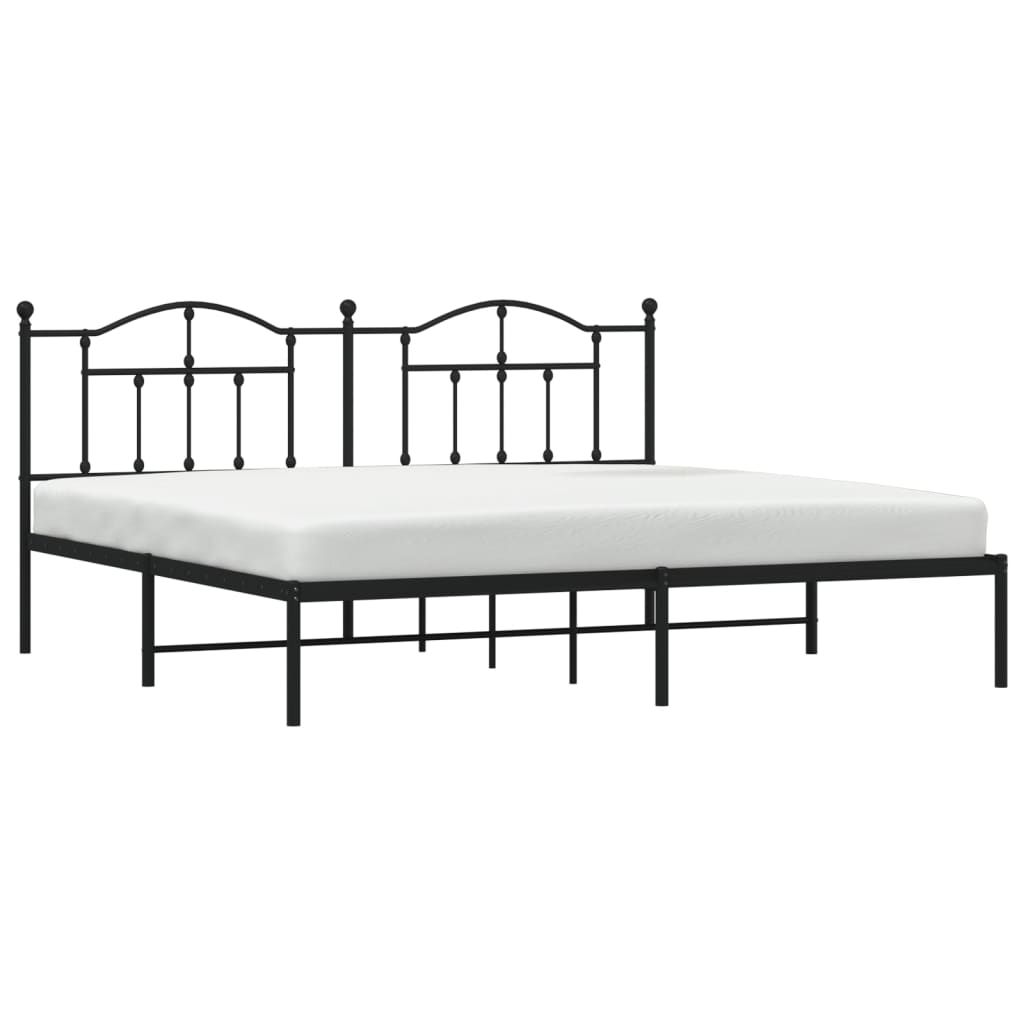 Black metal bed frame with ornate headboard