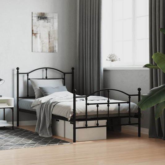 Black metal twin bed frame with ornate headboard and footboard