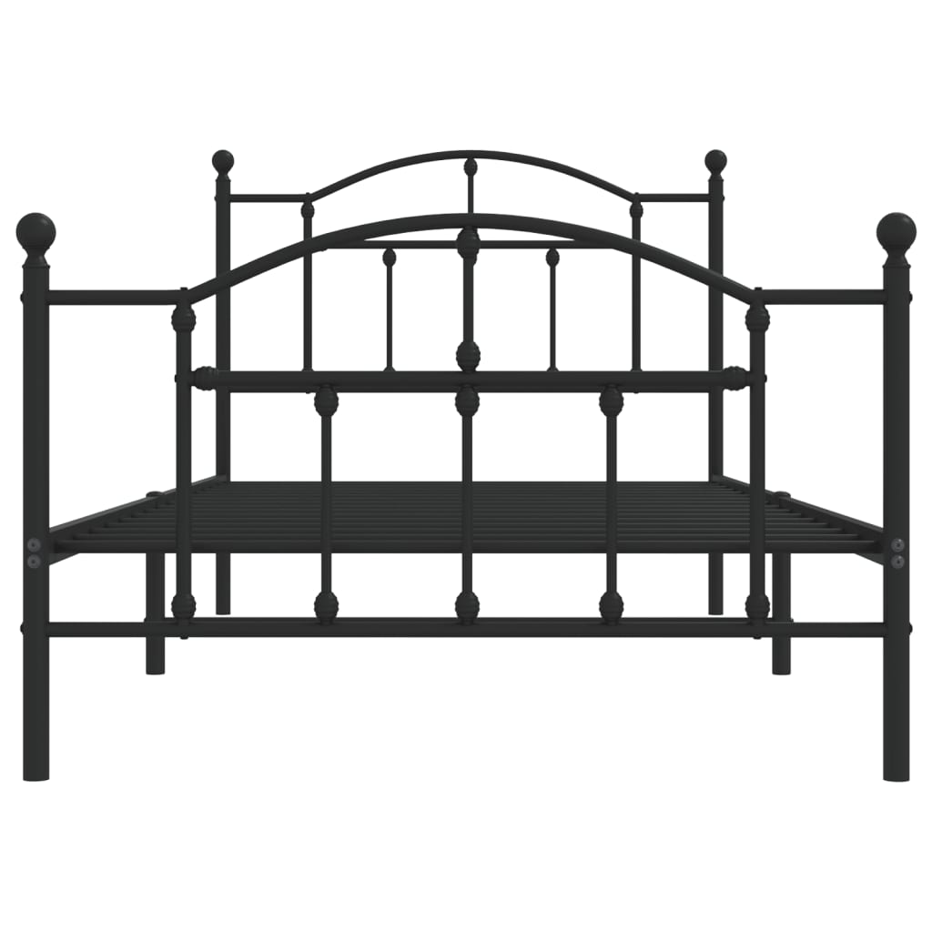 Ornate black metal bed frame with curved headboard and footboard