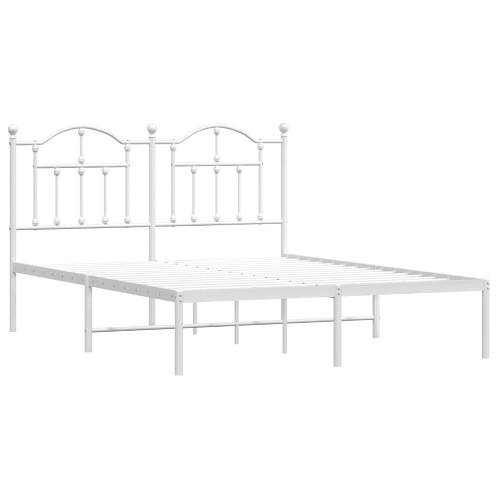 White metal bed frame with ornate headboard and mattress