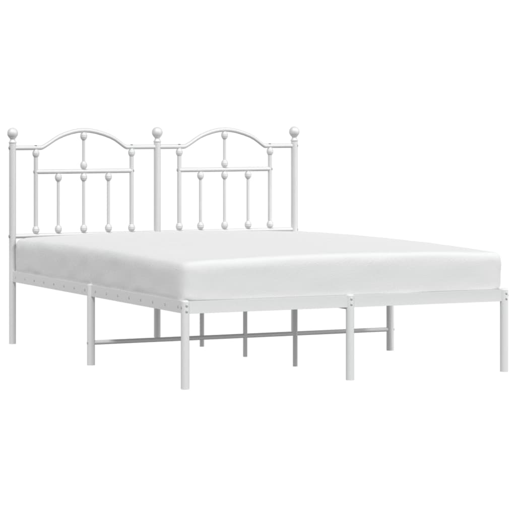 White metal bed frame with ornate headboard