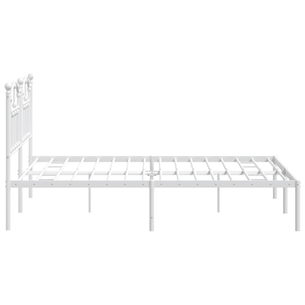 White metal bed frame with ornate headboard and mattress