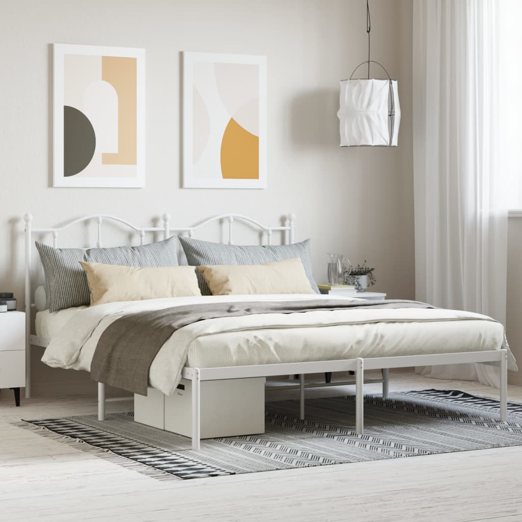 White metal twin bed frame with decorative headboard and footboard