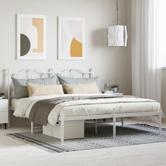 White metal twin bed frame with decorative headboard and footboard