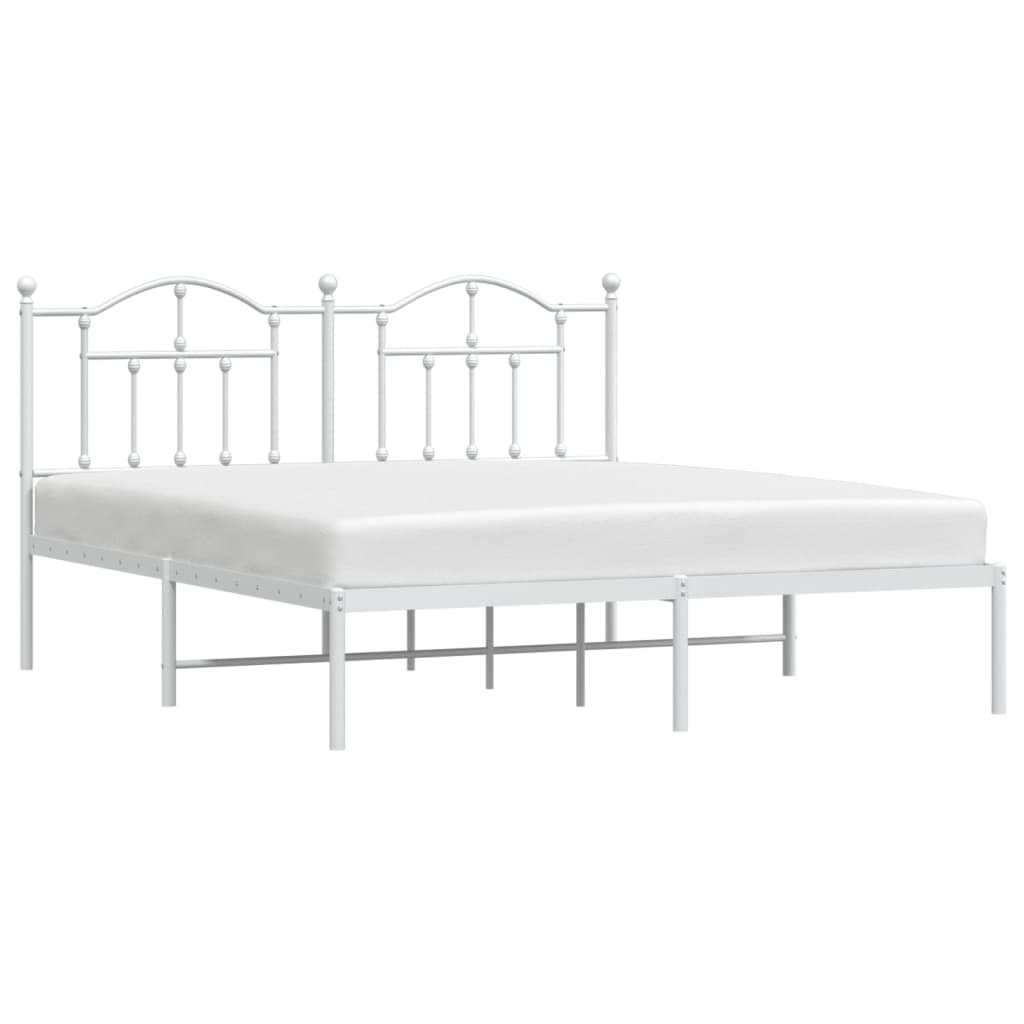 White metal bed frame with ornate headboard and footboard detail