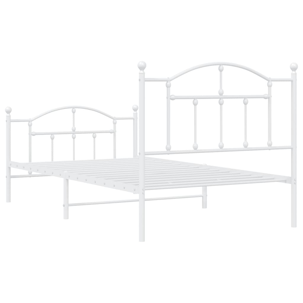 White metal bed frame with decorative finials and a slatted base