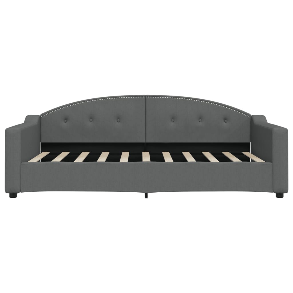 Grey fabric daybed with button tufting and nailhead trim