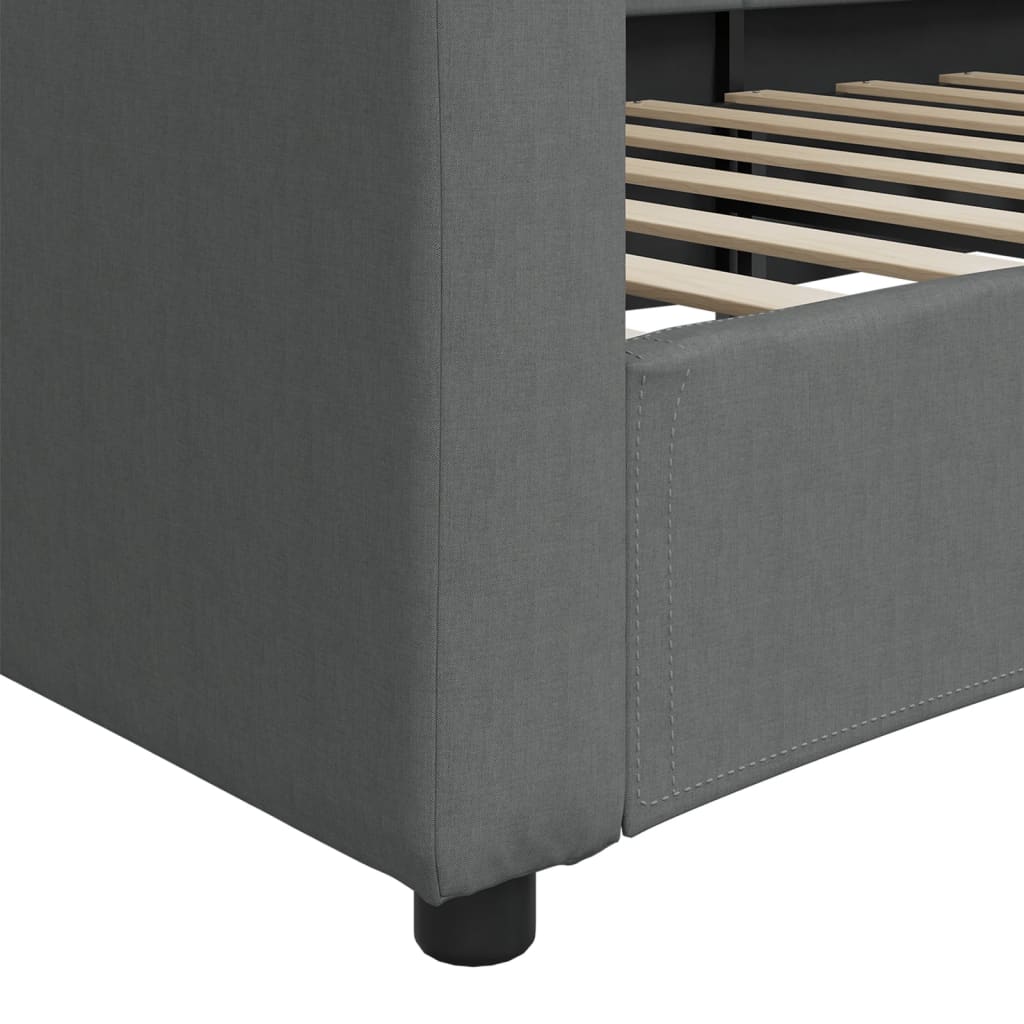 Gray upholstered sofa bed with curved back and armrests