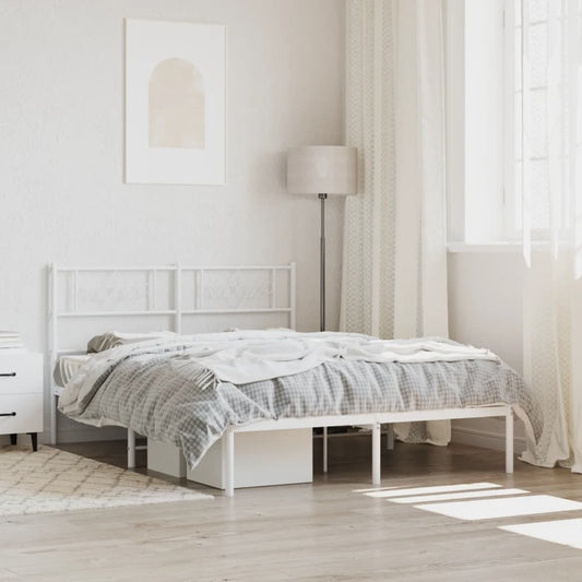 White metal twin bed frame with decorative headboard and footboard