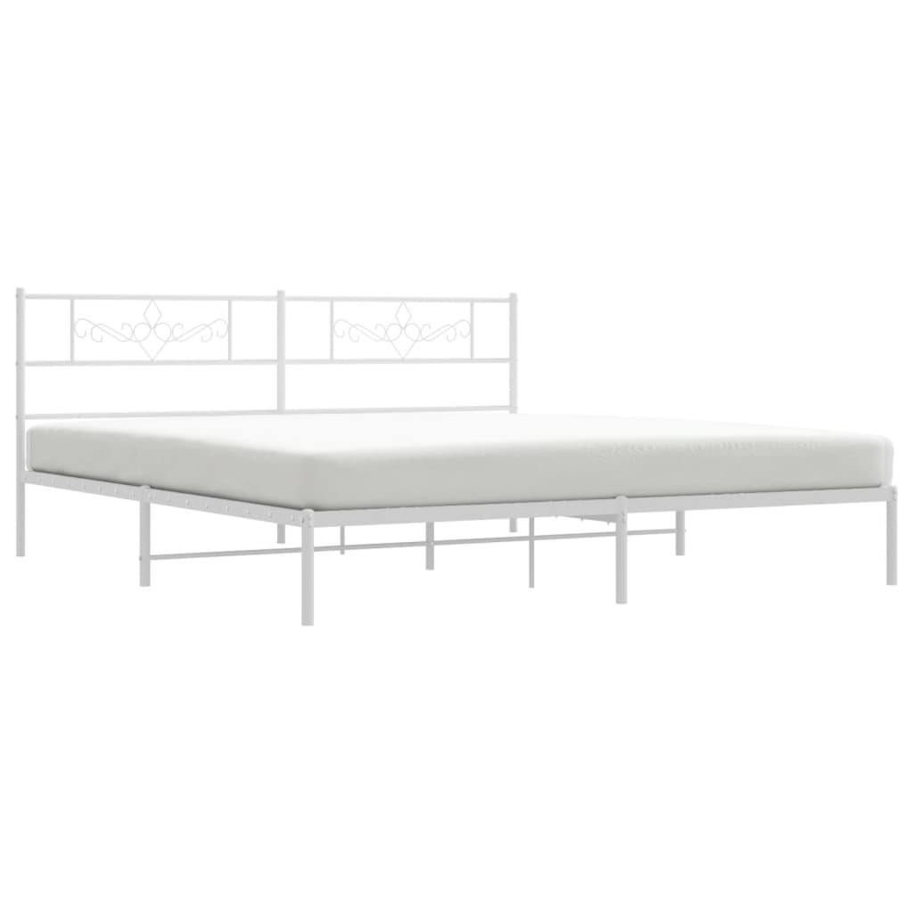 White metal bed frame with ornate headboard details and sturdy slat support