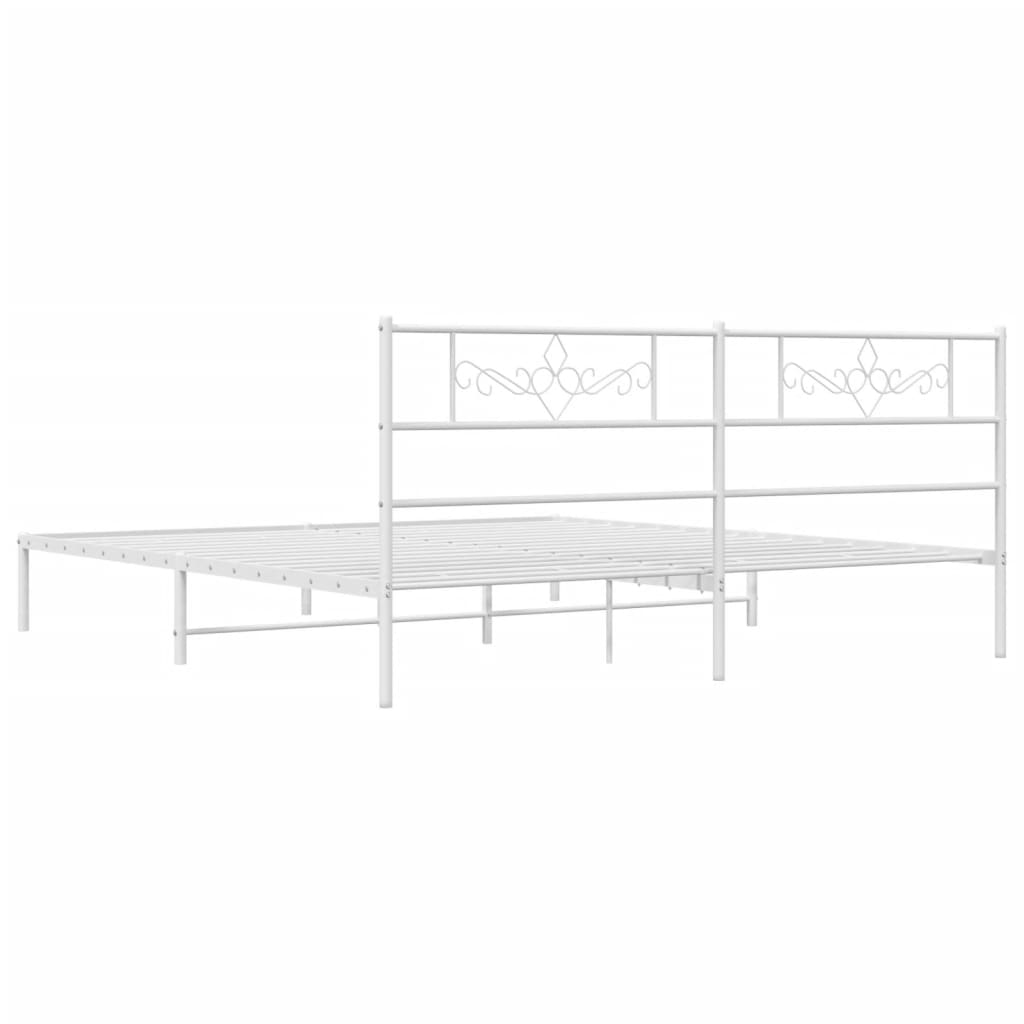 White metal bed frame with decorative headboard scrolls