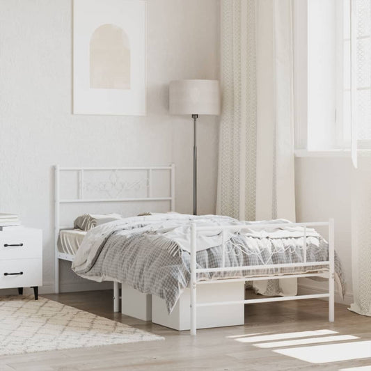 White metal twin bed frame with decorative scrollwork headboard and footboard