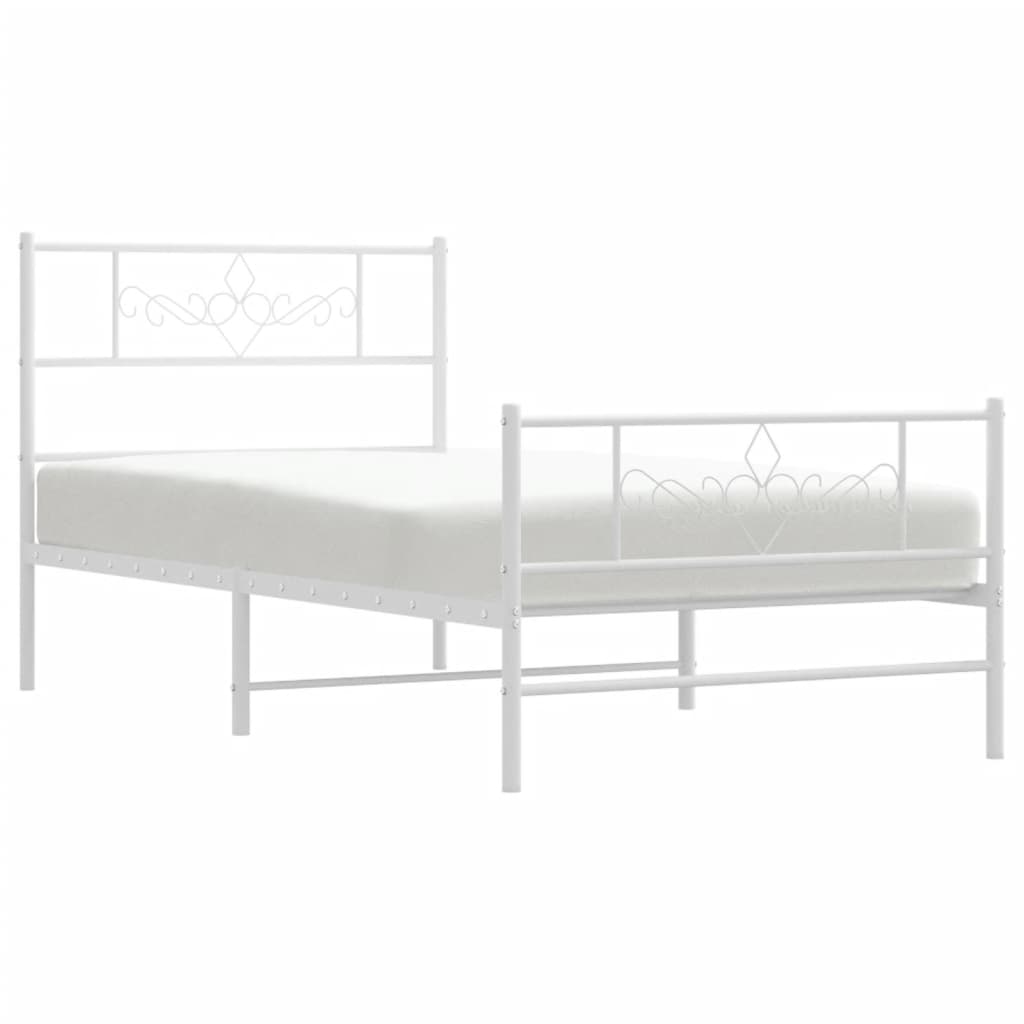 White metal twin bed frame with ornate headboard detail