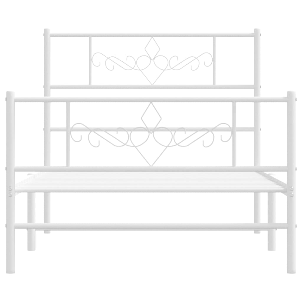 White metal bed frame with decorative scroll headboard and footboard