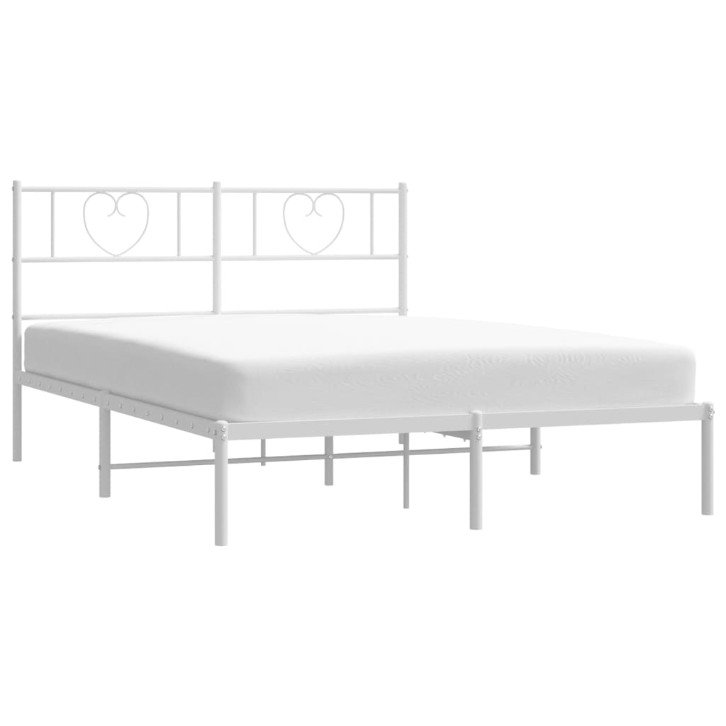 White metal bed frame with heartshaped headboard detail