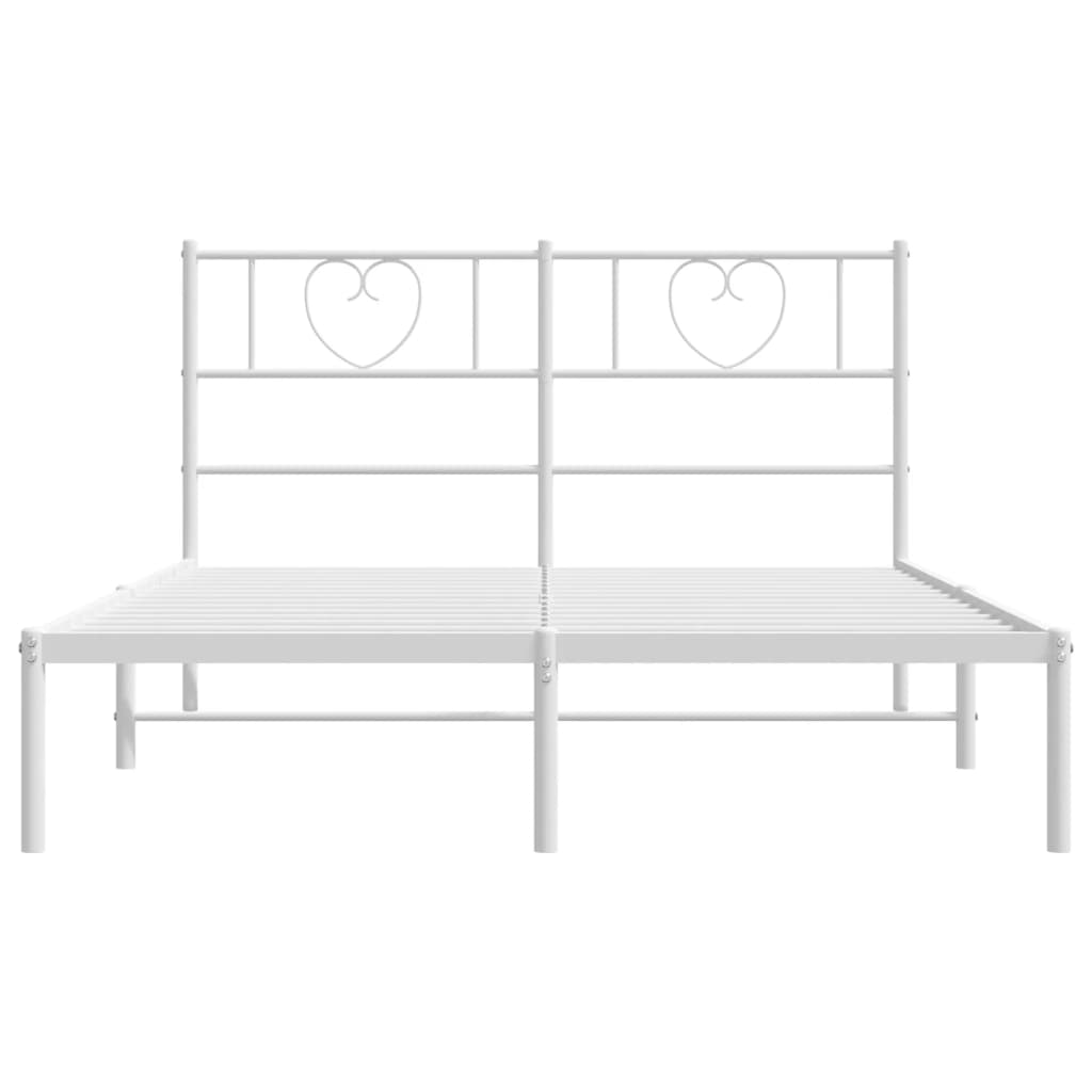White metal bed frame with heartshaped headboard detail