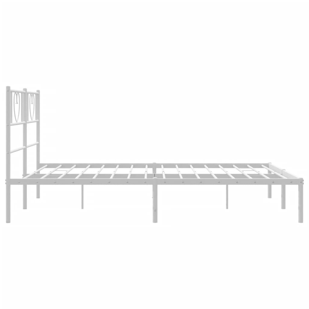 White metal bed frame with heartshaped headboard detail