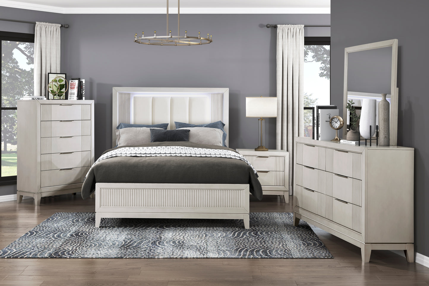 White upholstered headboard queen bed with modern nightstands and dressers