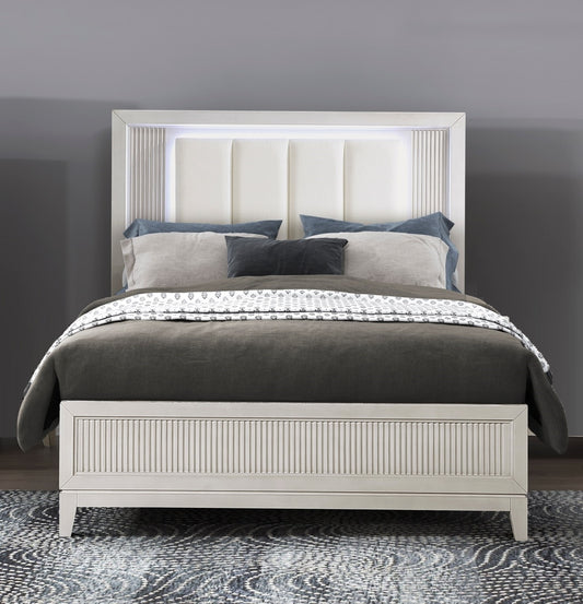 White upholstered platform bed with LED headboard lights and fluted detail