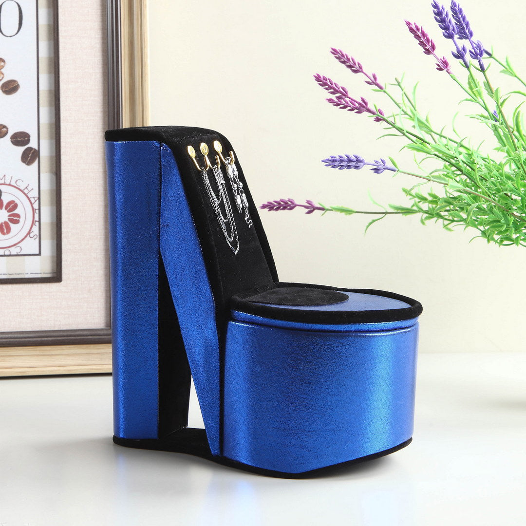 Blue stiletto heel jewelry box with silver necklaces displayed