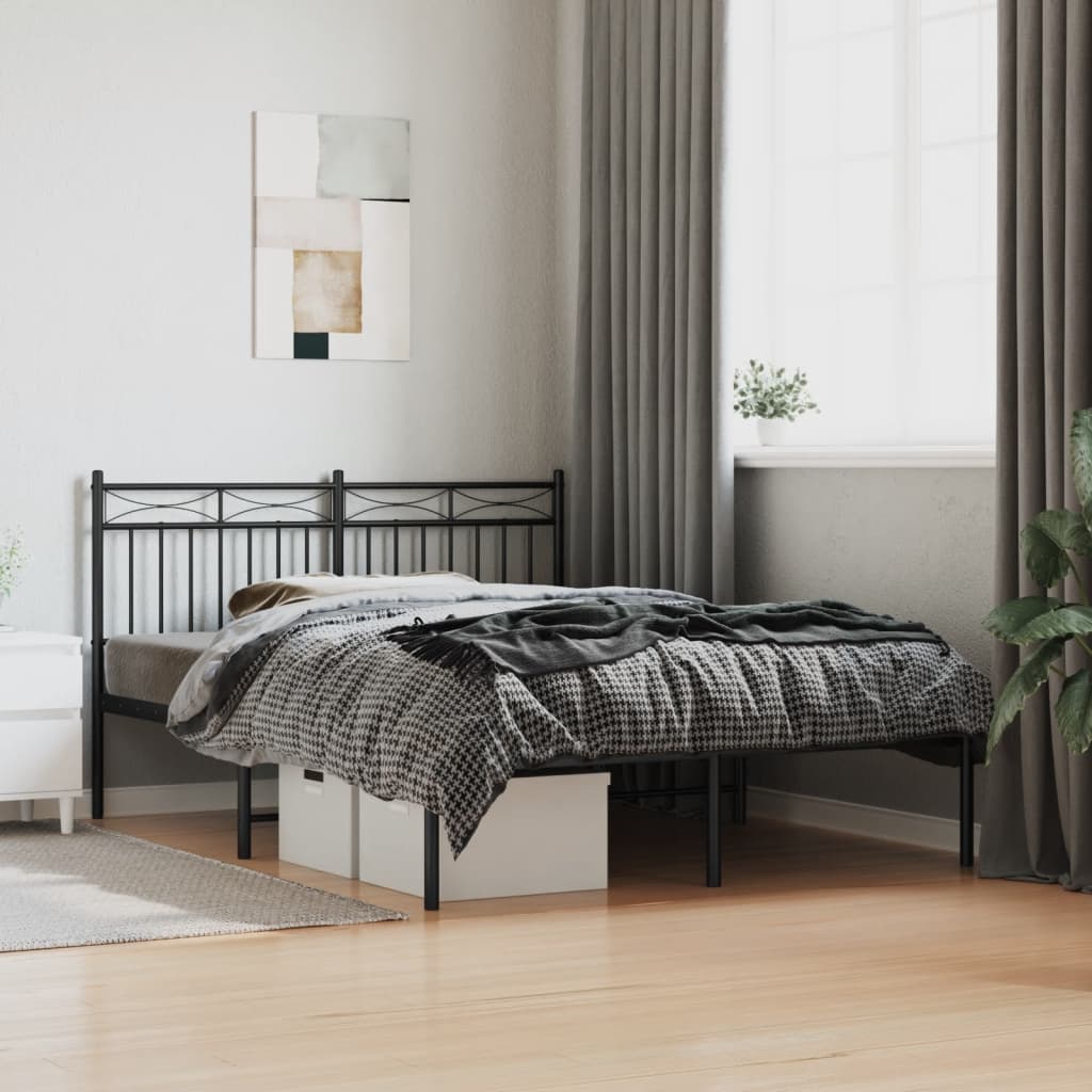 Black metal bed frame with a decorative headboard and footboard