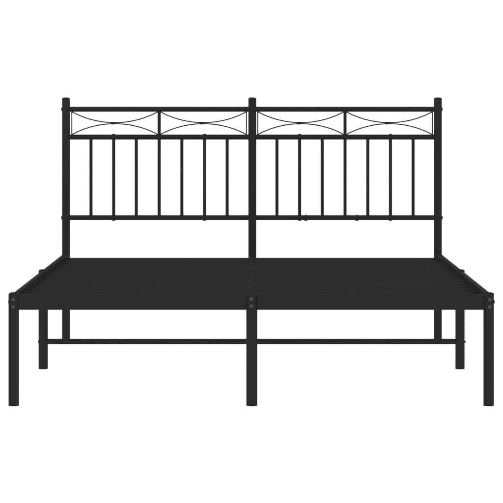 Black metal bed frame with a decorative headboard and mattress
