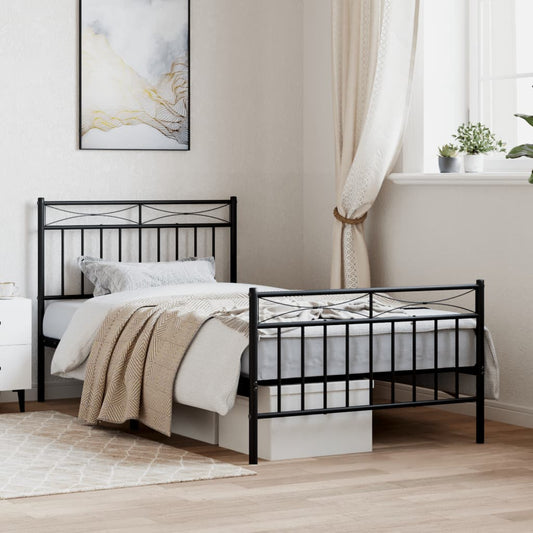 Black metal twin bed frame with ornate headboard and footboard