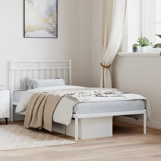 White metal single bed frame with decorative headboard and footboard
