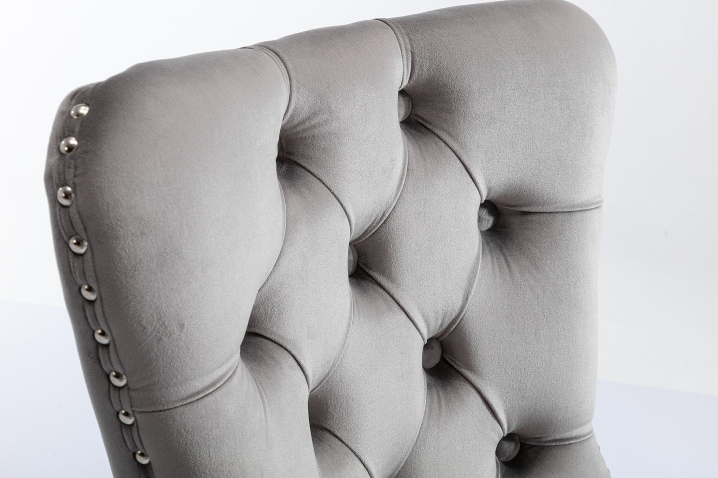 Tufted grey velvet accent chair with silver nailhead trim