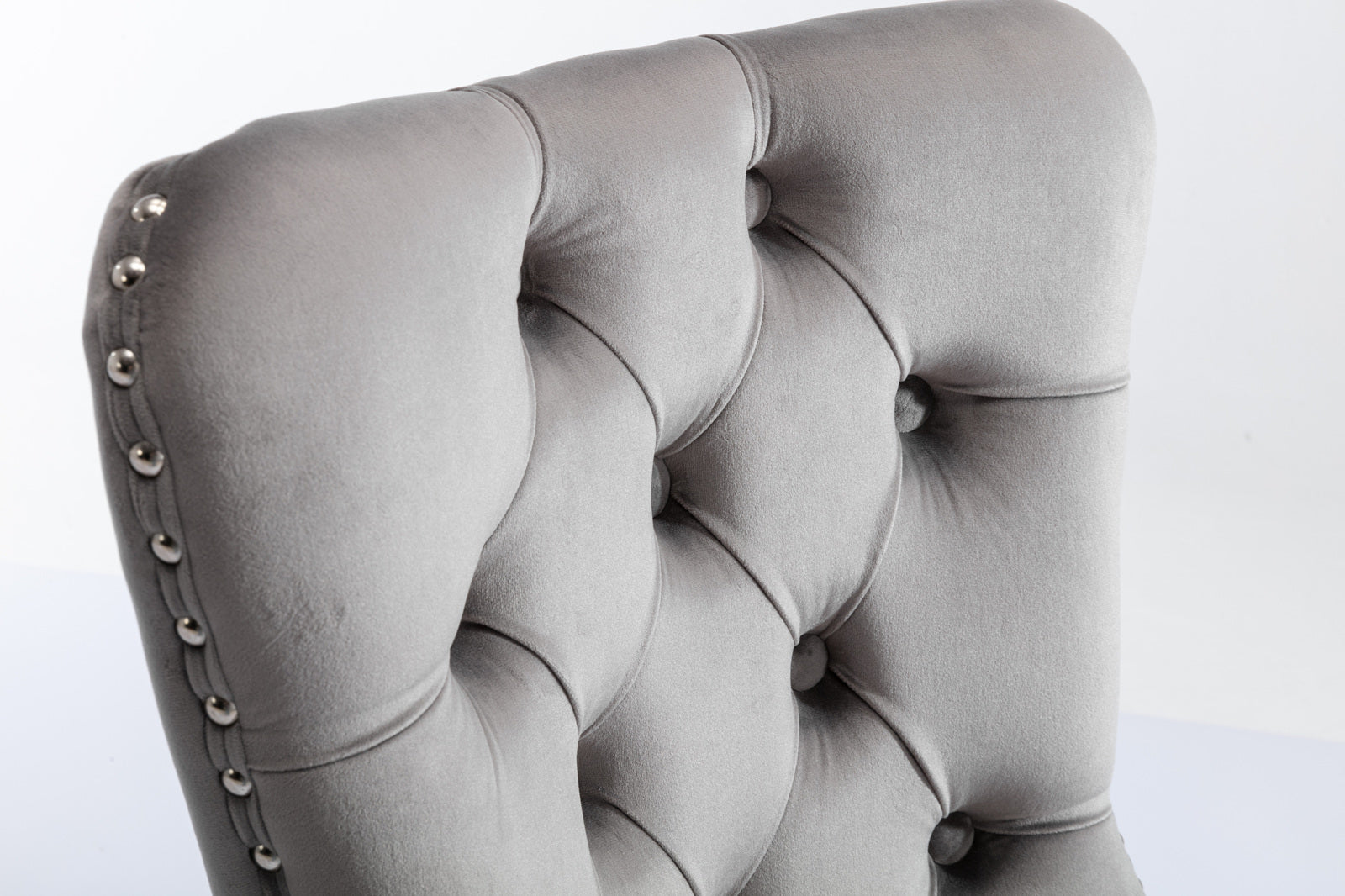 Tufted grey velvet accent chair with silver nailhead trim