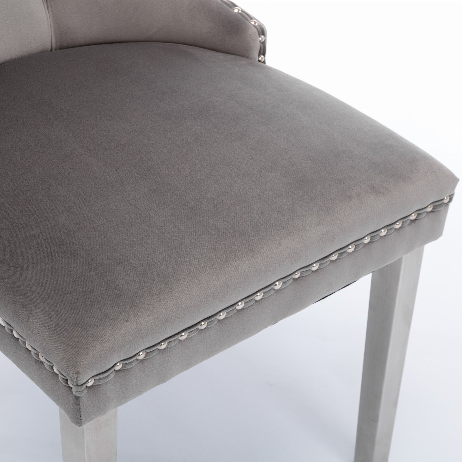 Grey velvet upholstered bar stool with silver nailhead trim