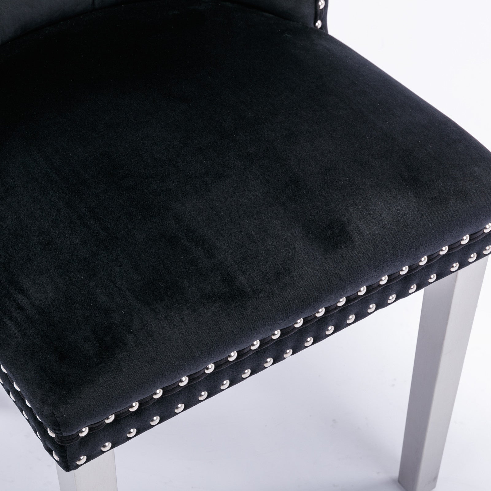 Black velvet dining chair with silver nailhead trim detail