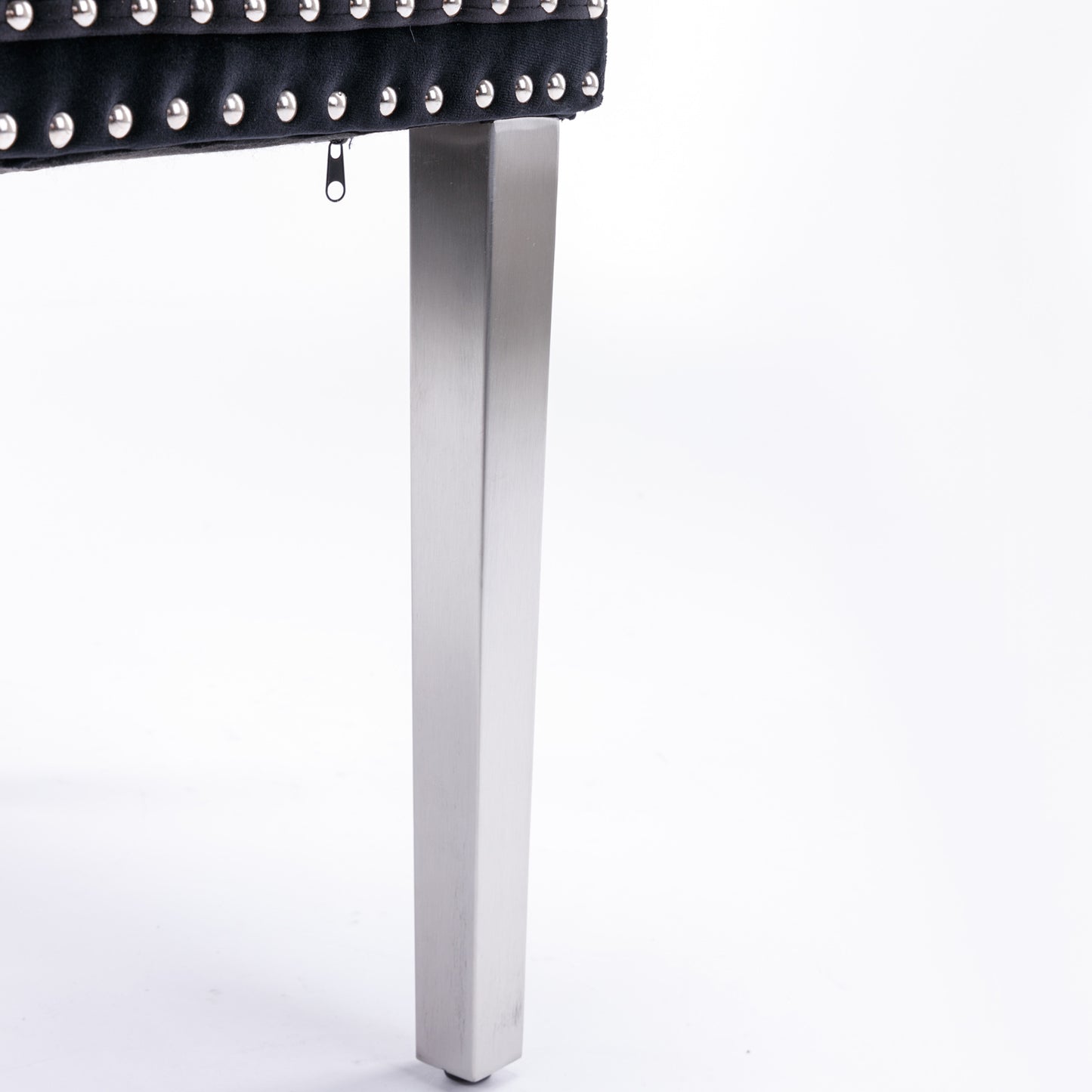 Black velvet tufted bench with silver nailhead trim and modern stainless steel legs