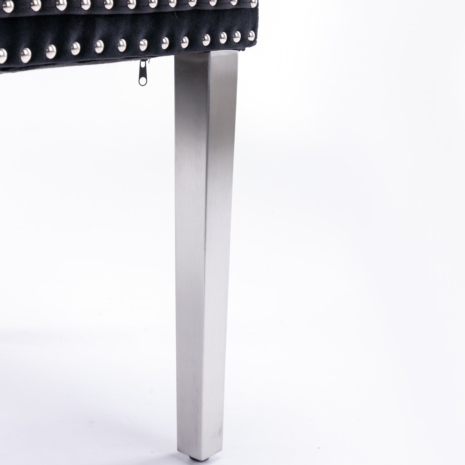 Black velvet tufted bench with silver nailhead trim and modern stainless steel legs