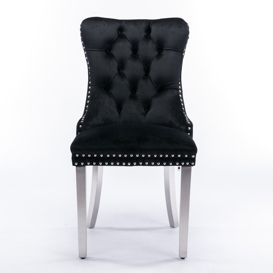 Black velvet dining chair with tufted back and silver nailhead trim