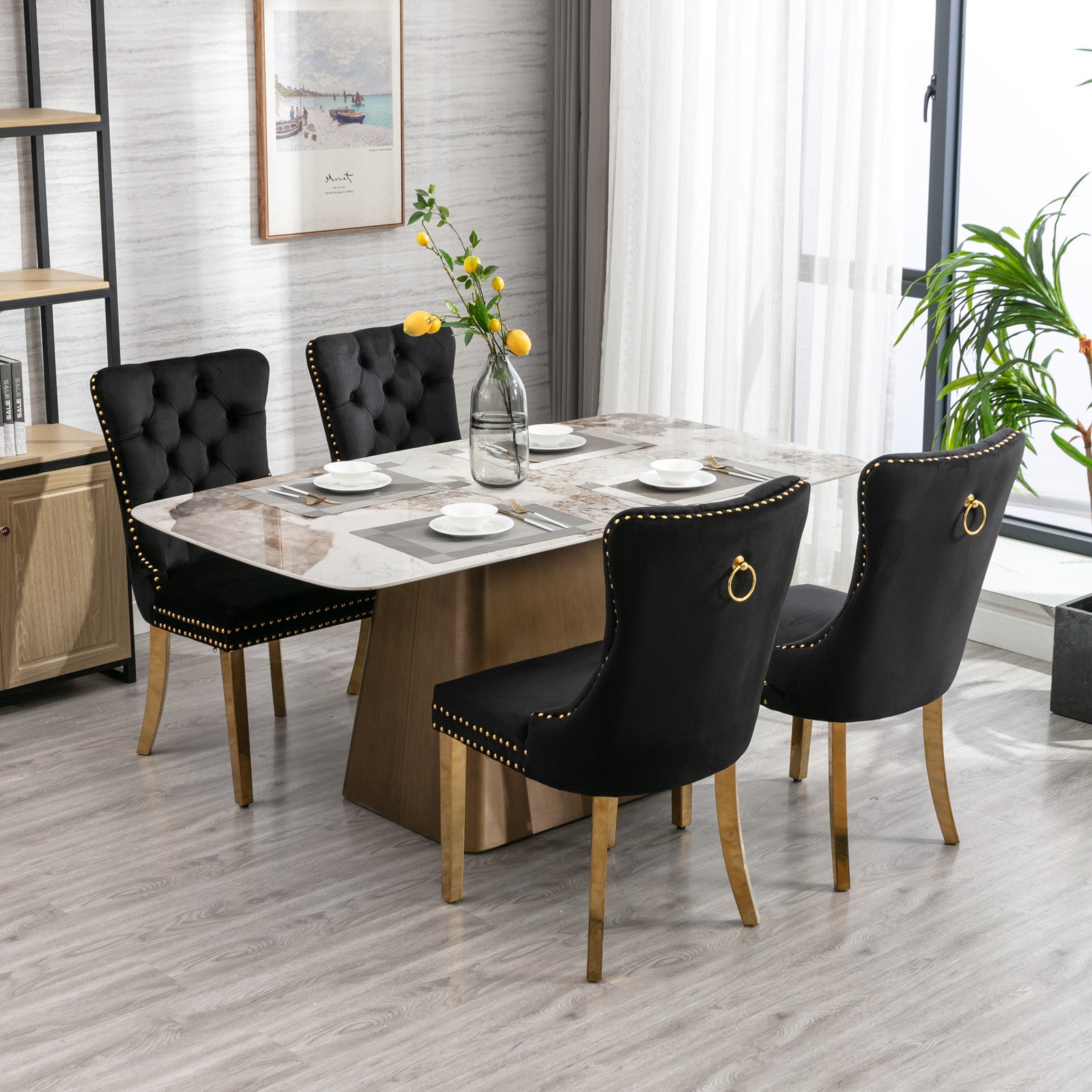 Black velvet dining chair with gold ring and nailhead trim