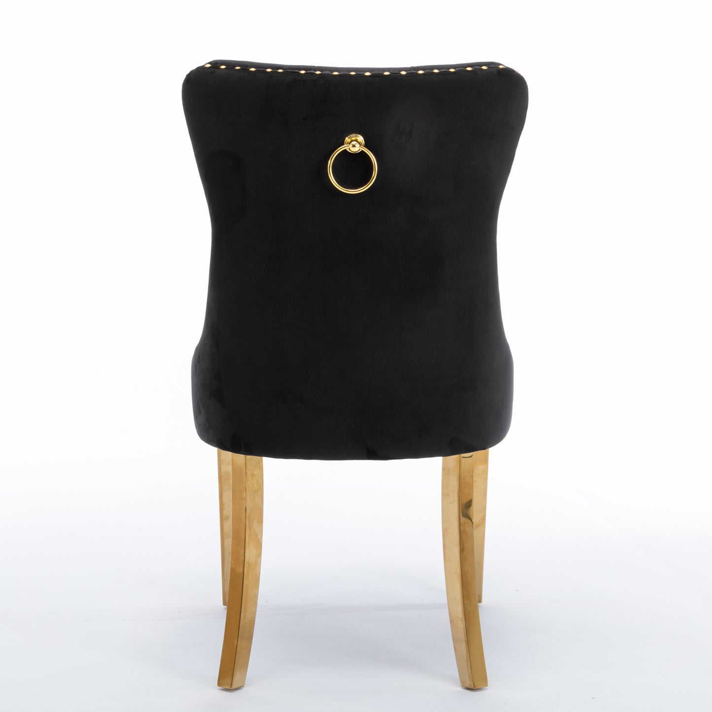 Black velvet dining chair with gold ring pull and brass legs