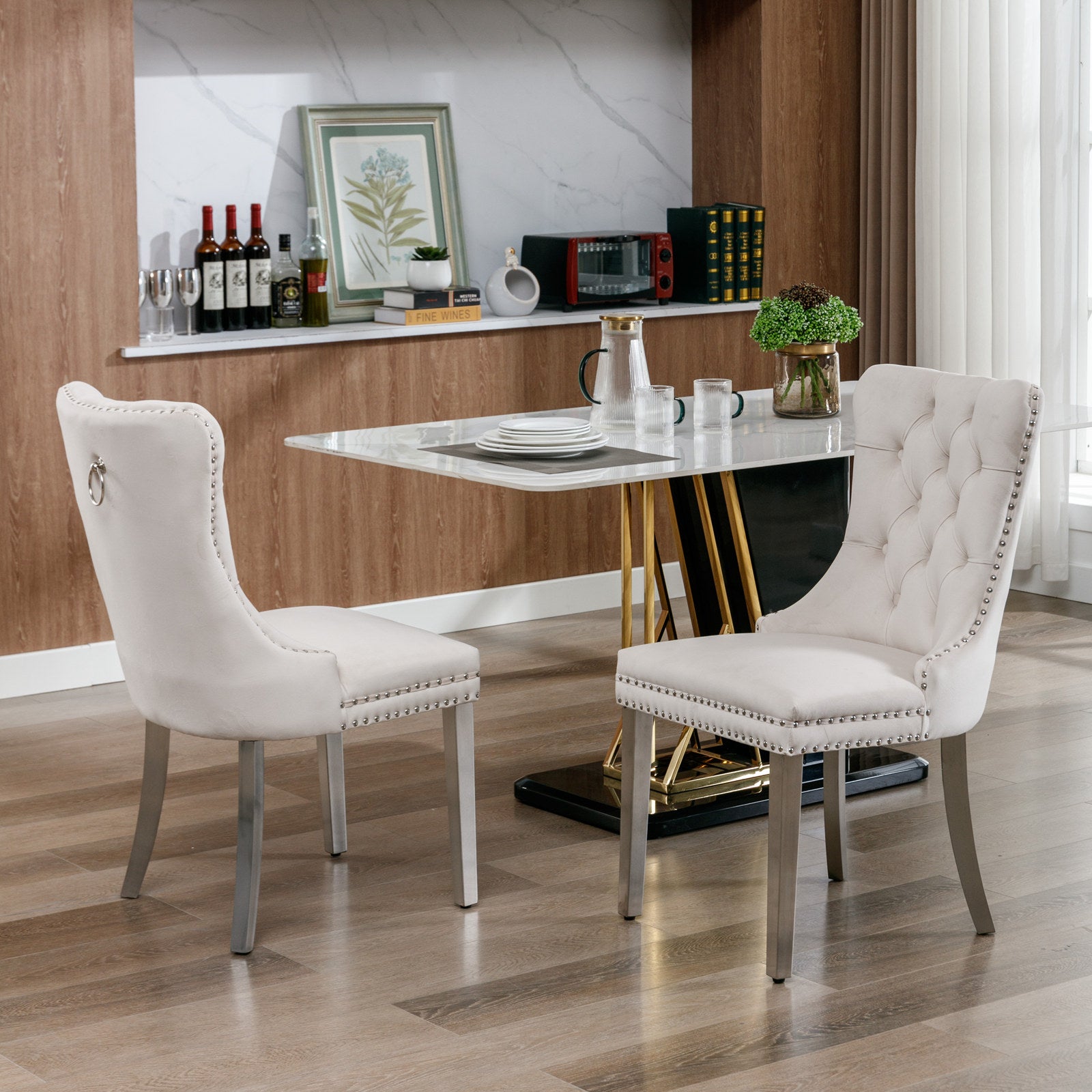 Cream velvet dining chair with silver nailhead trim and ring accent
