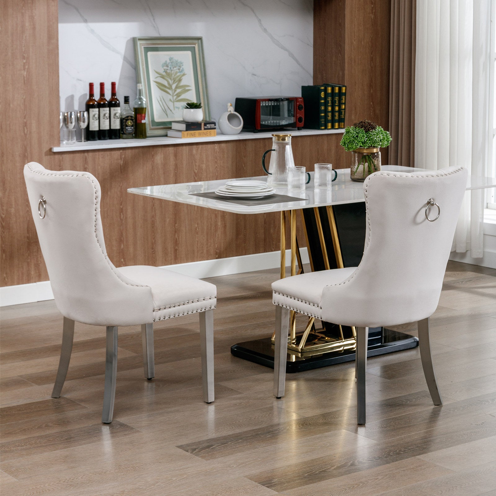Elegant beige velvet dining chair with silver nailhead trim and ring pull accent
