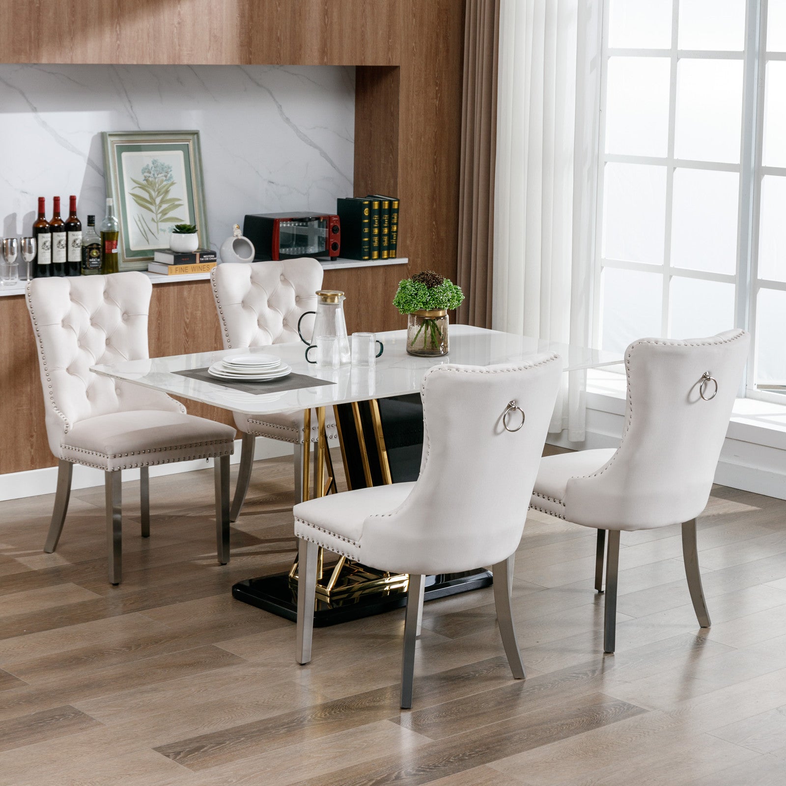 Plush cream velvet dining chair with tufted back and silver nailhead trim