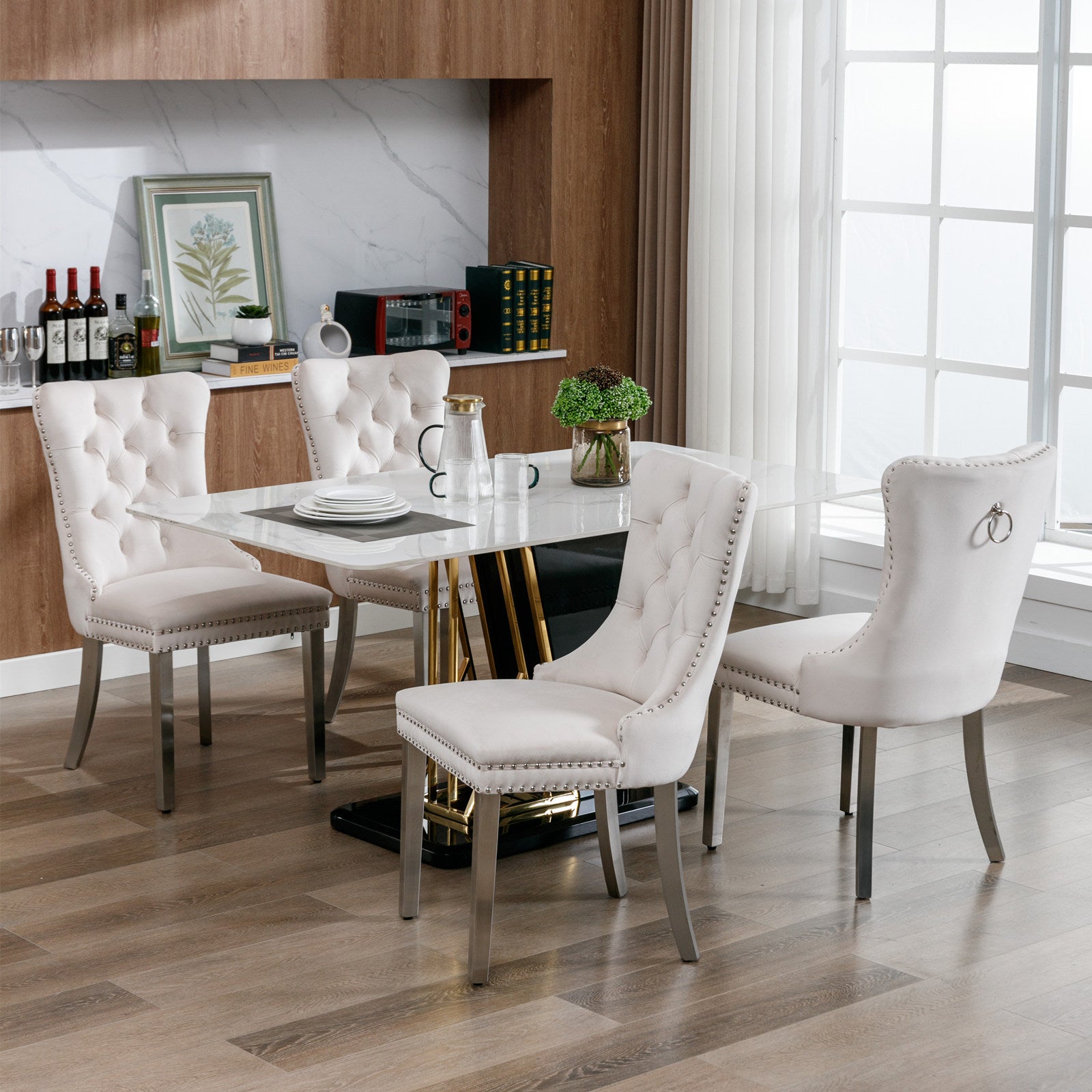 Tufted cream velvet dining chair with silver nailhead trim and metal legs