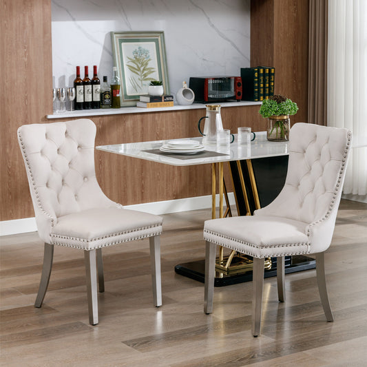 Cream velvet dining chair with tufted back and silver nailhead trim