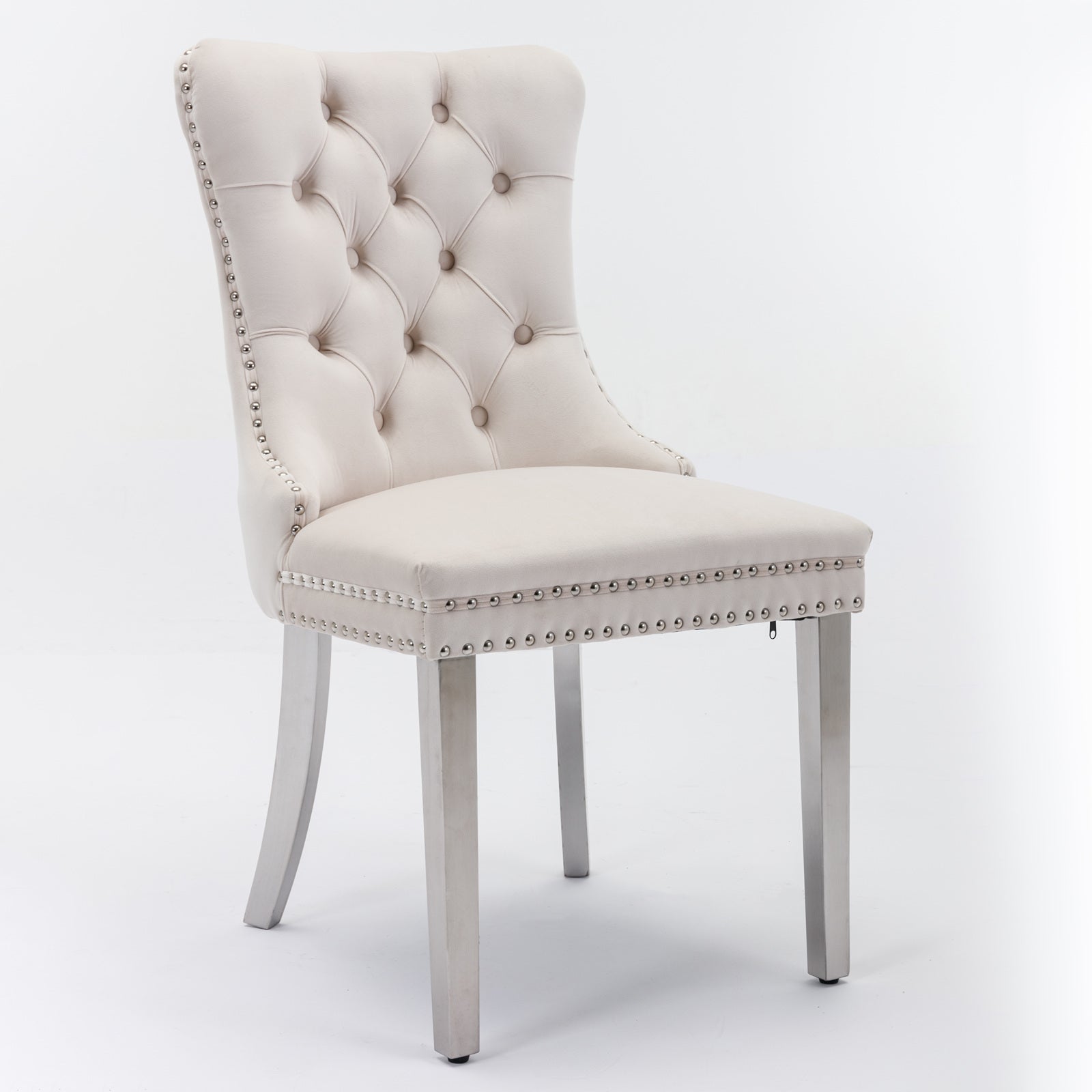 Cream velvet tufted dining chair with silver nailhead trim and brushed metal legs