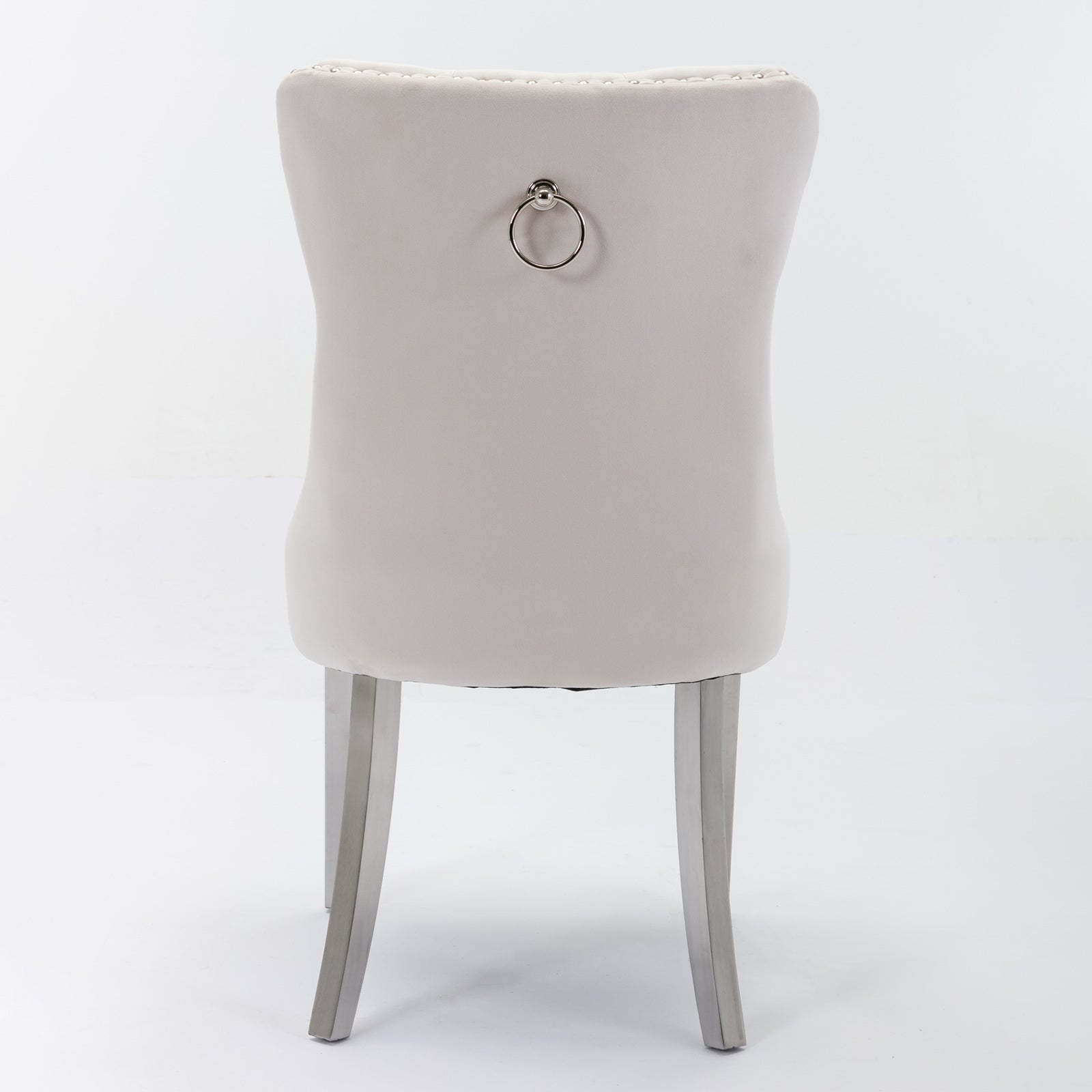 Light gray velvet dining chair with silver ring pull